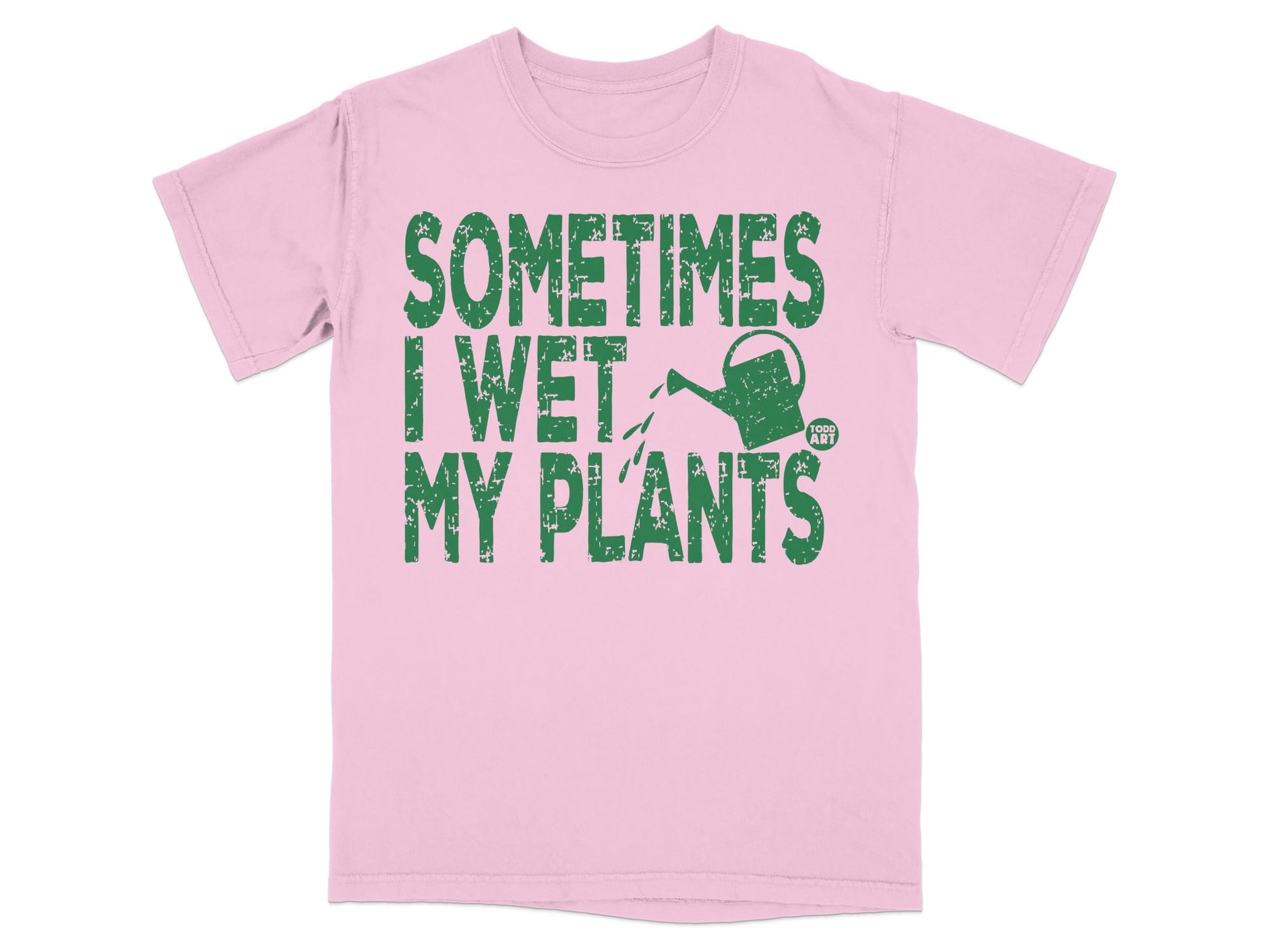 Pink t-shirt with green text reading "Sometimes I wet my plants" and a small watering can graphic.