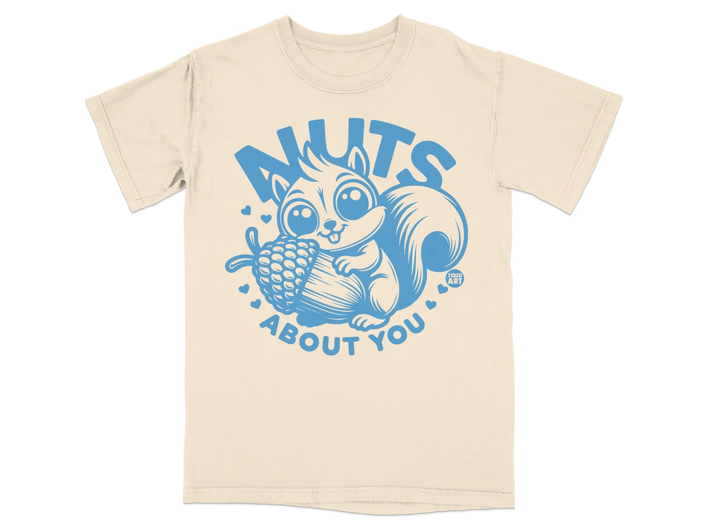 Cream t-shirt with blue cartoon squirrel holding acorn, "NUTS ABOUT YOU" text.