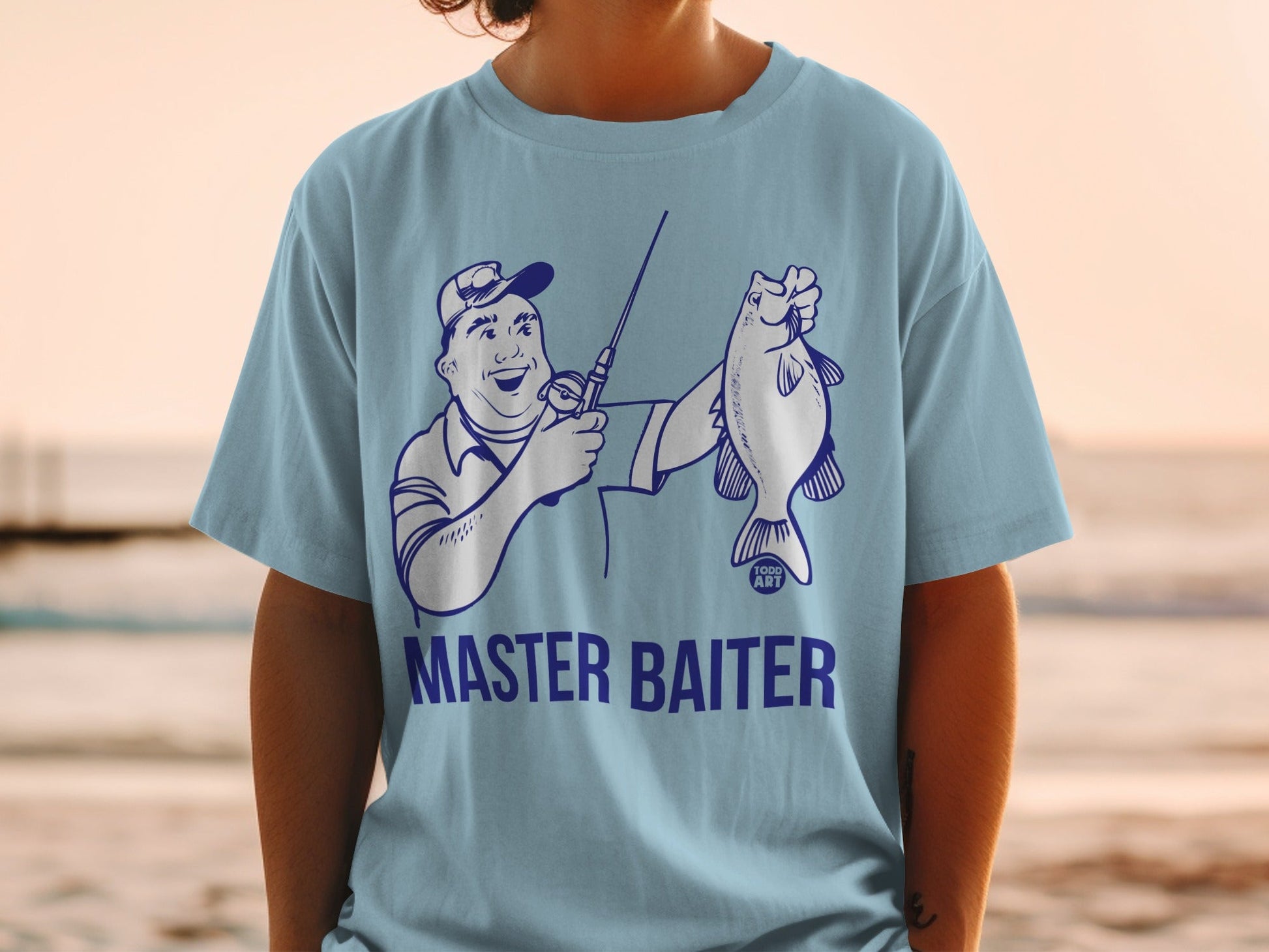 Light blue t-shirt with cartoon fisherman holding a fish, "MASTER BAITER" text.