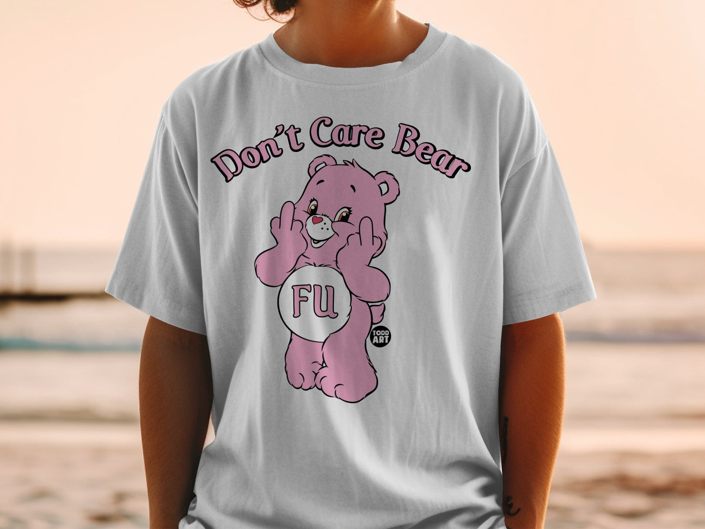 Pink Care Bear graphic tee with "FU" and middle fingers displayed.