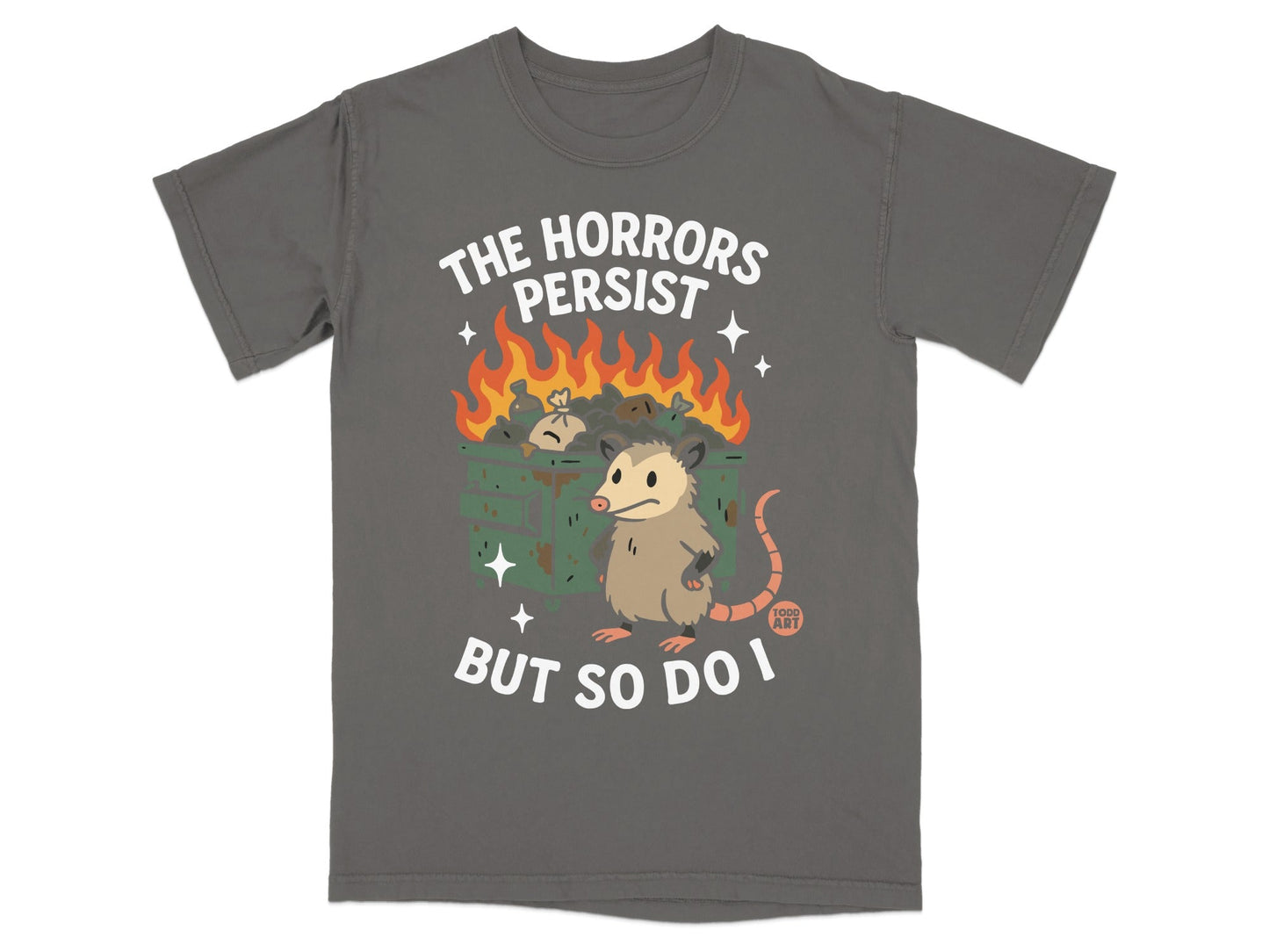 Gray t-shirt with a possum standing by a burning trash can, text reads "THE HORRORS PERSIST BUT SO DO I".