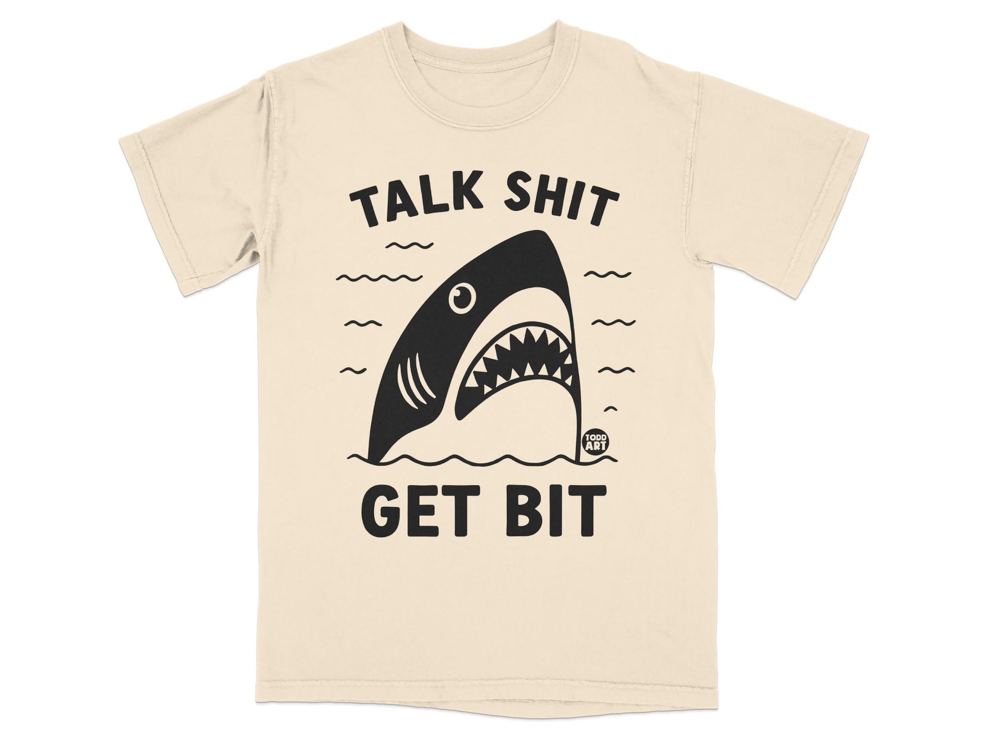 Cream t-shirt with a black shark graphic and text "TALK SHIT GET BIT".