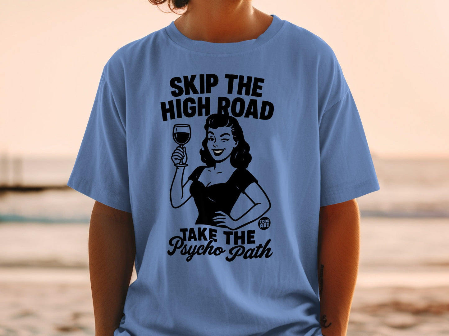 Black graphic on a blue t-shirt: "Skip the high road, take the psycho path."