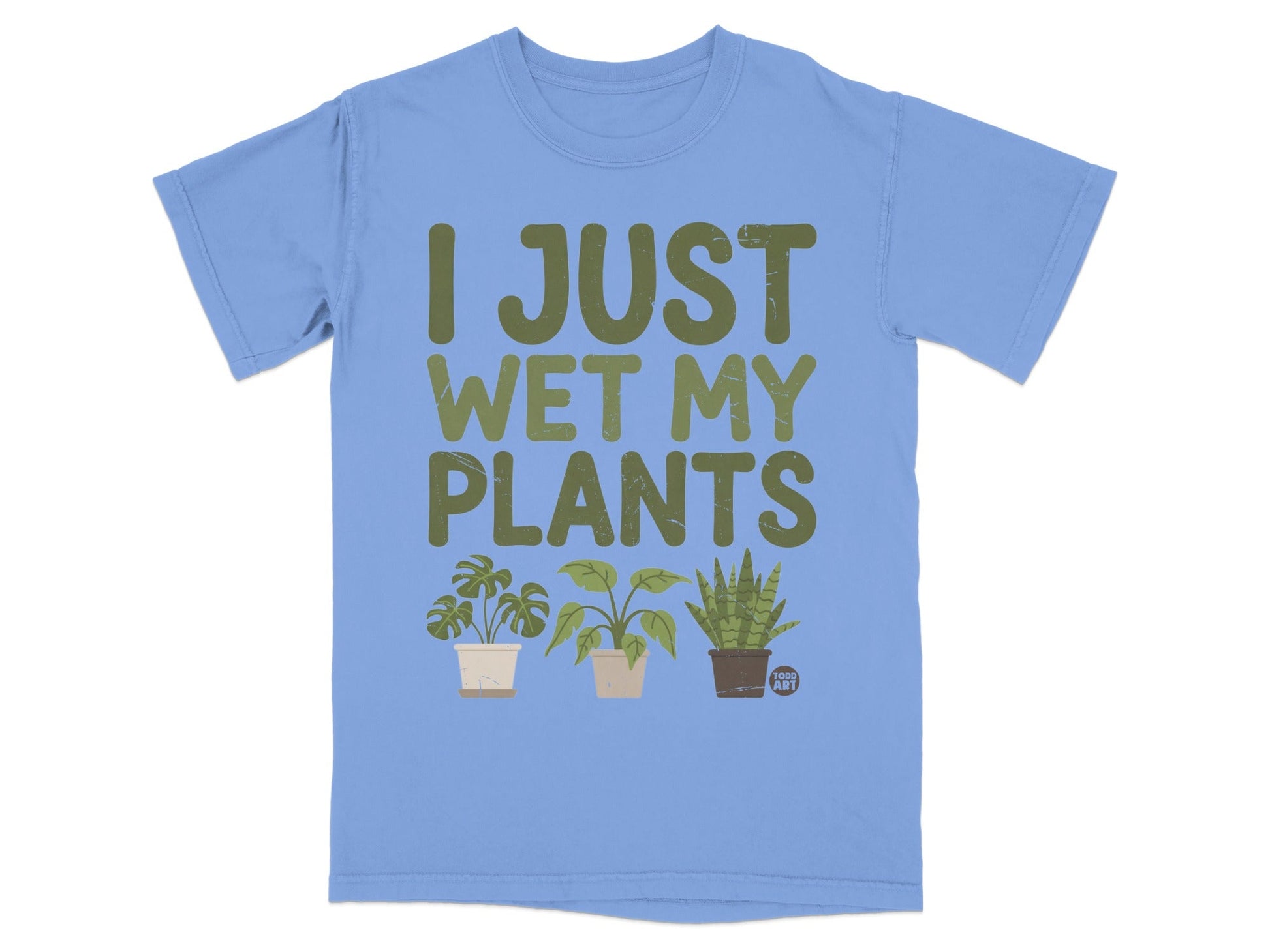 Light blue t-shirt with green text "I JUST WET MY PLANTS" and three potted plants.