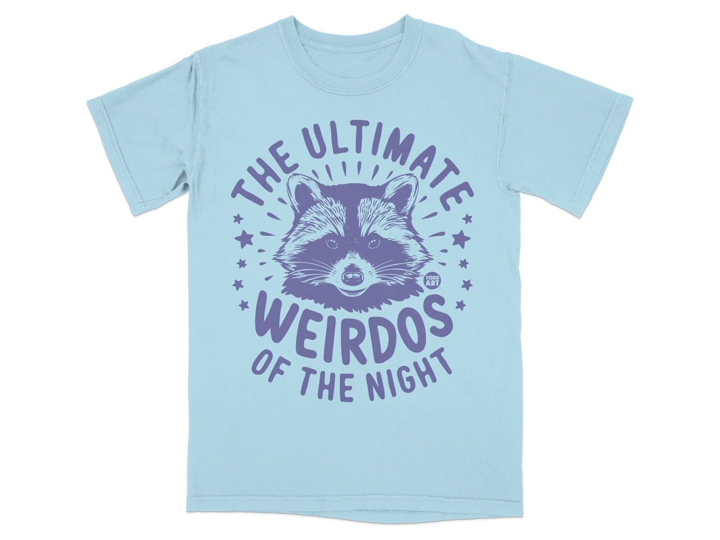 Light blue t-shirt with purple text and raccoon graphic: "The ultimate weirdos of the night."