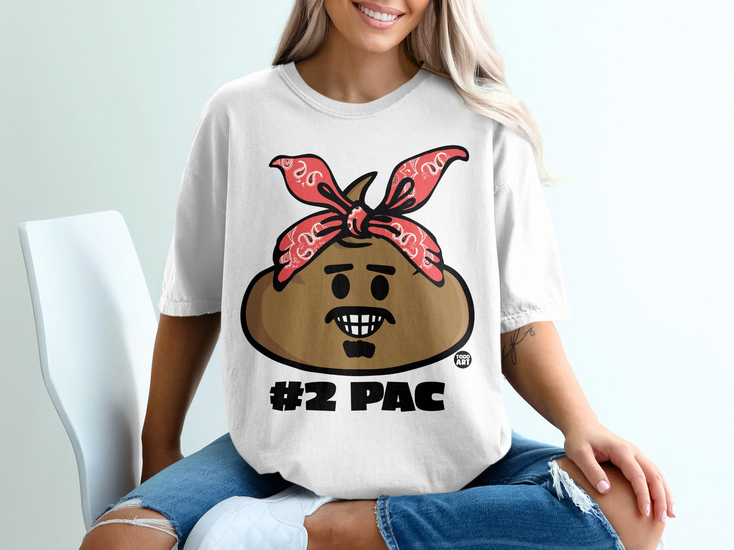 T-shirt with cartoon character wearing a red bandana and "#2 PAC" text.