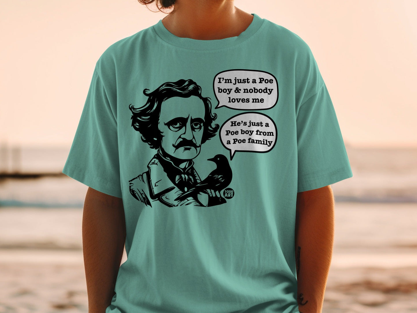 Edgar Allan Poe graphic with speech bubbles on a teal t-shirt.