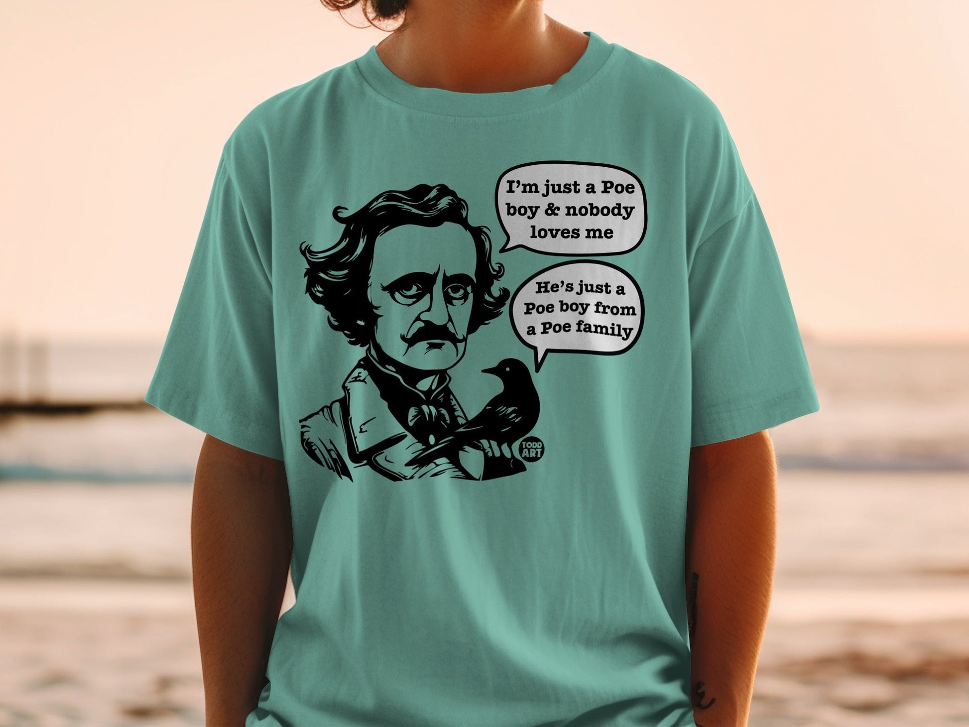 Edgar Allan Poe graphic with speech bubbles on a teal t-shirt.
