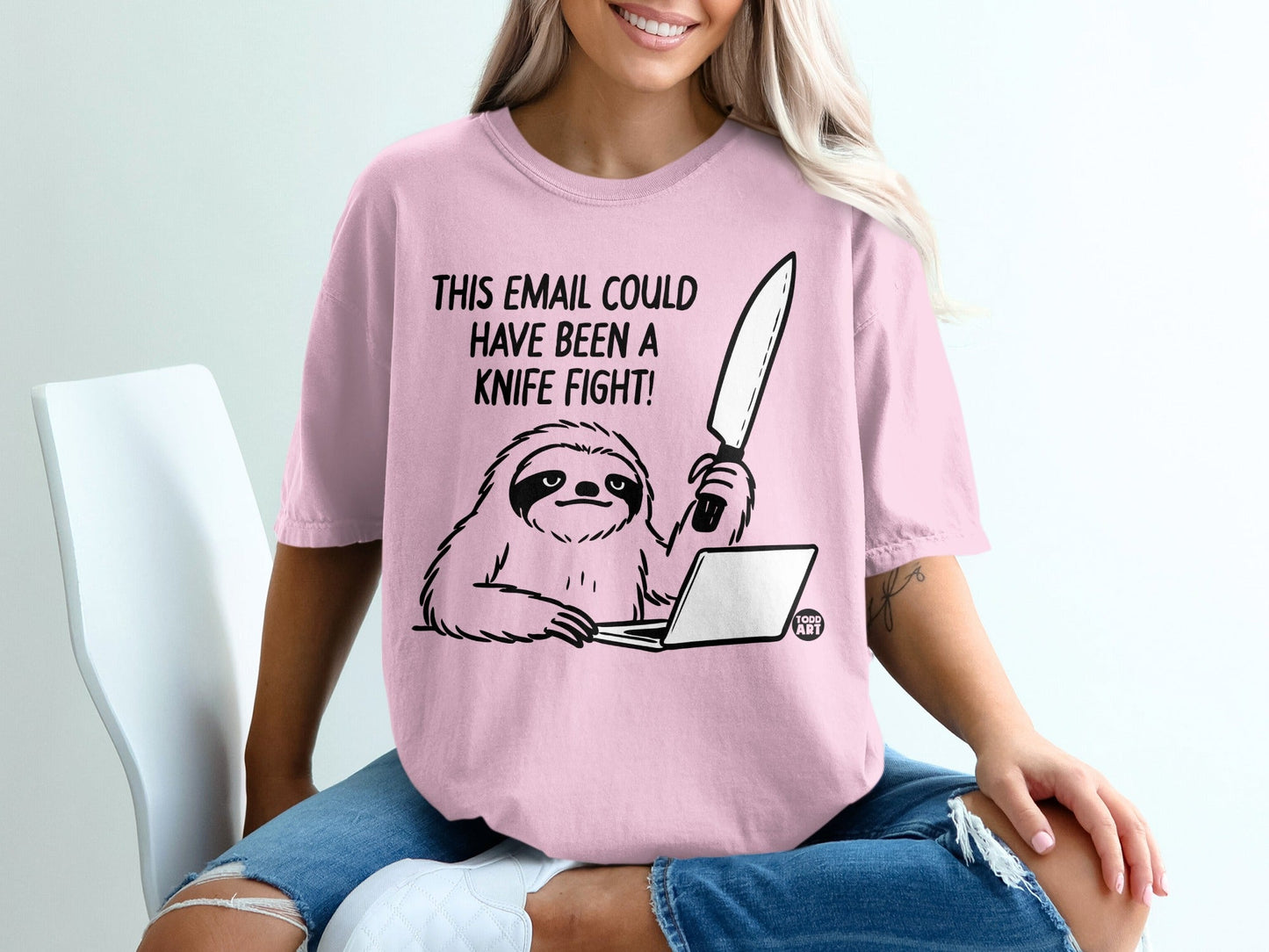 Pink t-shirt with a sloth at a laptop holding a knife, text "This email could have been a knife fight!"