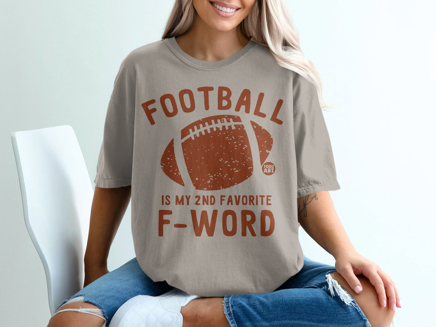 Tan t-shirt with "FOOTBALL IS MY 2ND FAVORITE F-WORD" and football graphic.