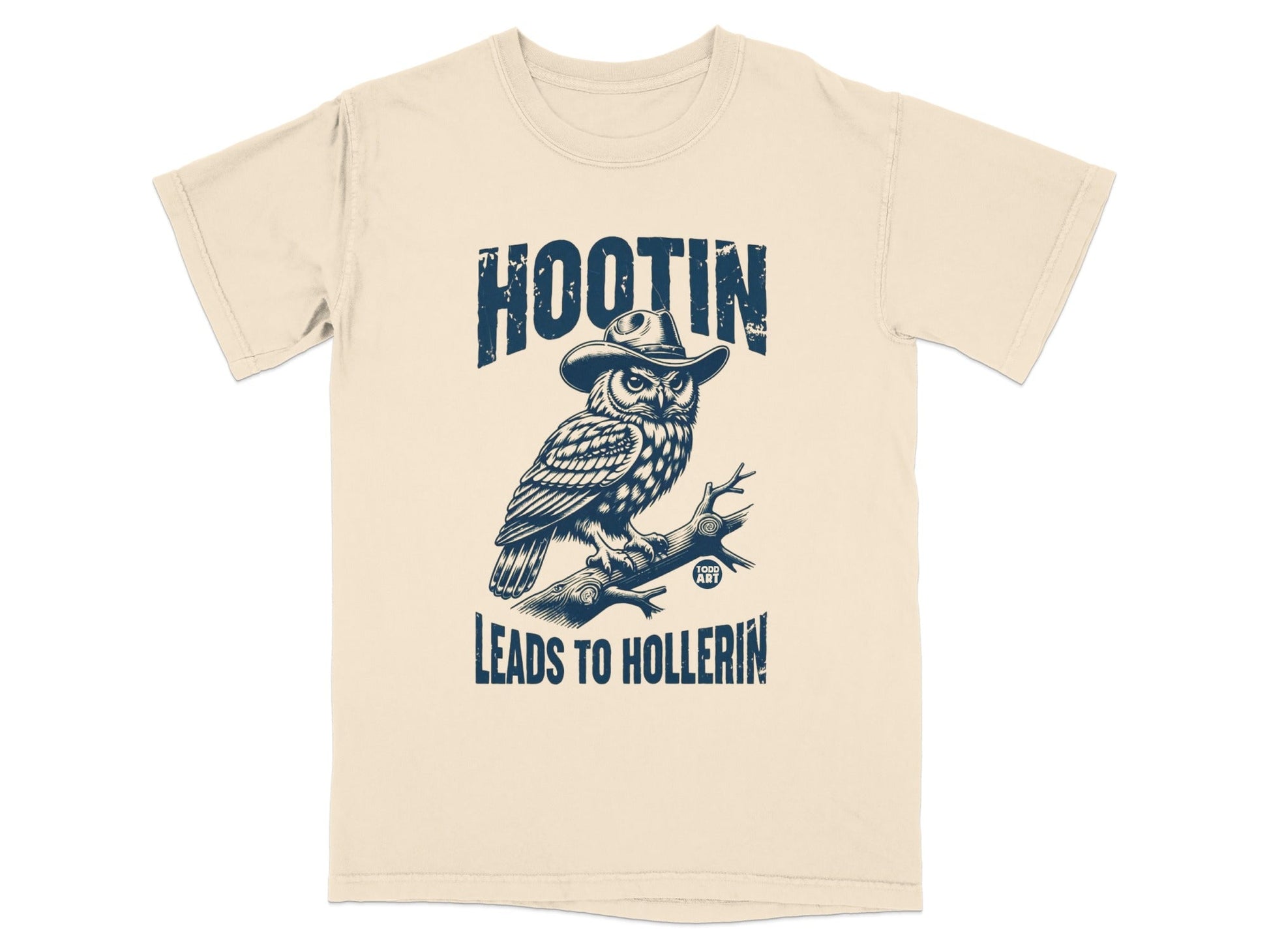 Cream t-shirt with an owl wearing a hat, text reads "HOOTIN' LEADS TO HOLLERIN'".
