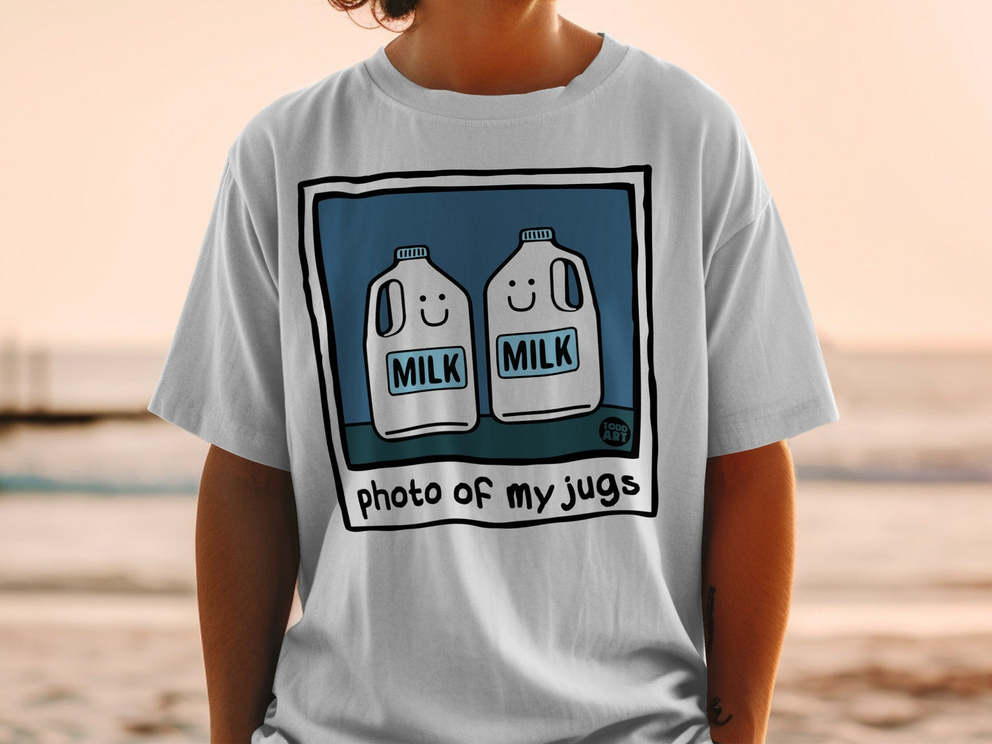 T-shirt with cartoon milk jugs and "photo of my jugs" text.