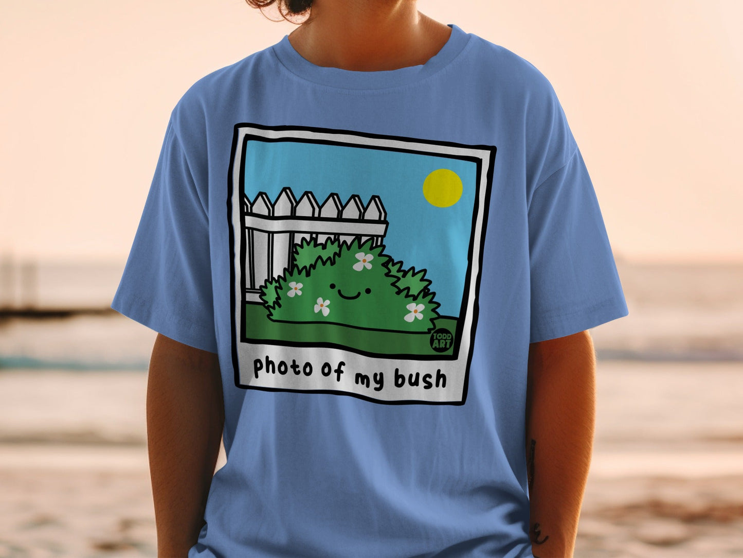 T-shirt with cartoon bush and "photo of my bush" text.