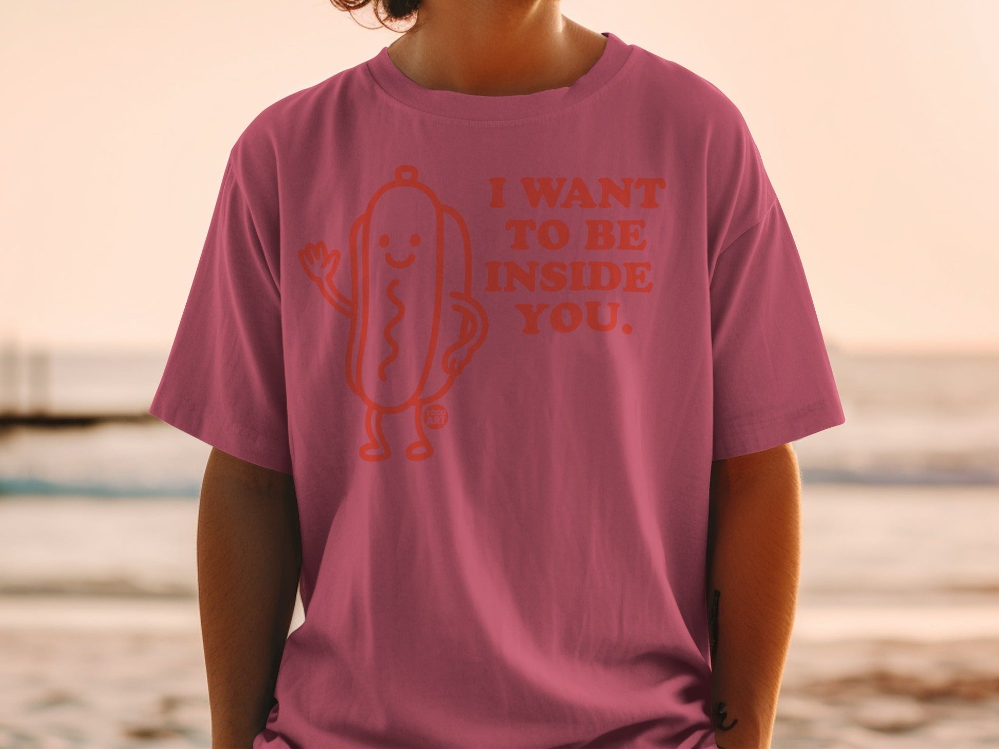 Pink t-shirt with "I WANT TO BE INSIDE YOU." and a hot dog graphic.