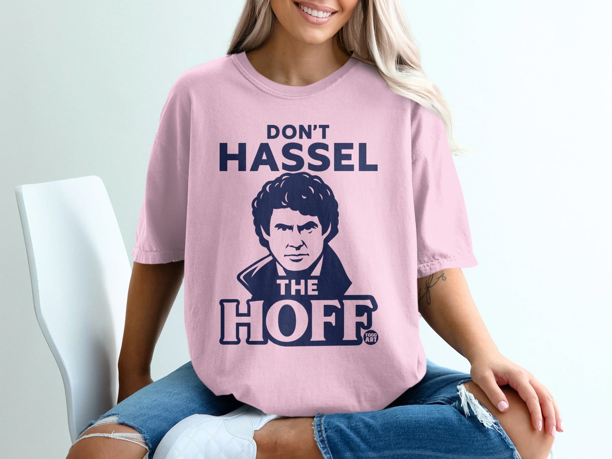Pink t-shirt with "Don't HASSEL THE HOFF" and David Hasselhoff graphic.