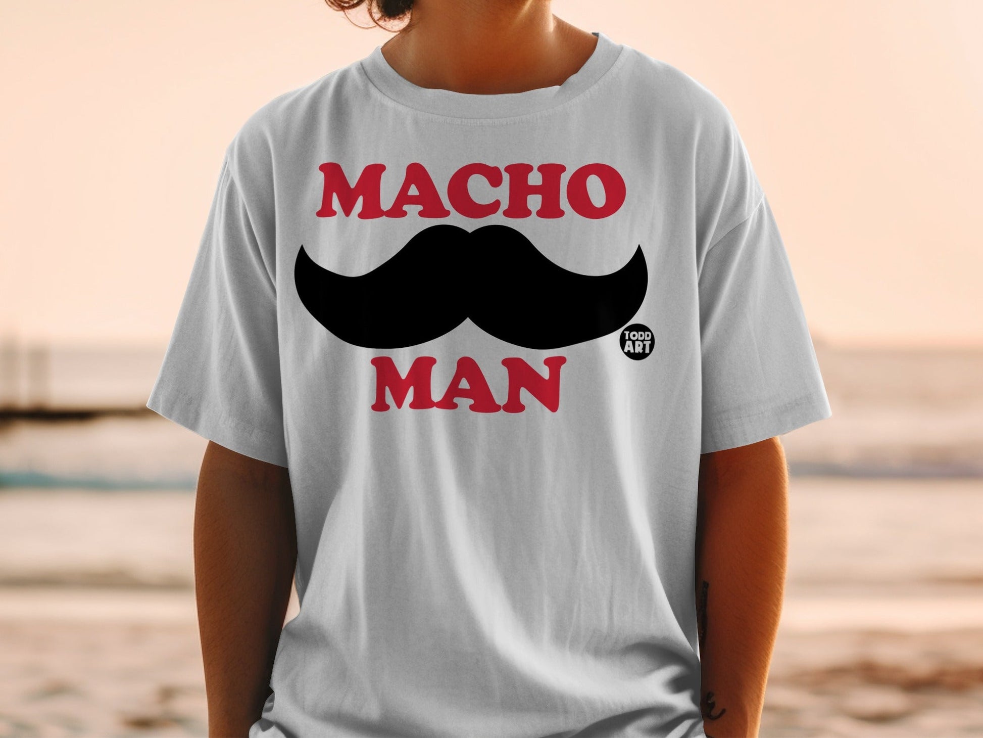 White t-shirt with "MACHO MAN" and a large black mustache.