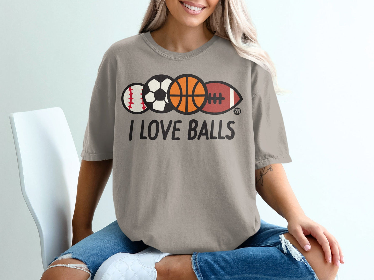 T-shirt with "I LOVE BALLS" text and baseball, soccer, basketball, football.