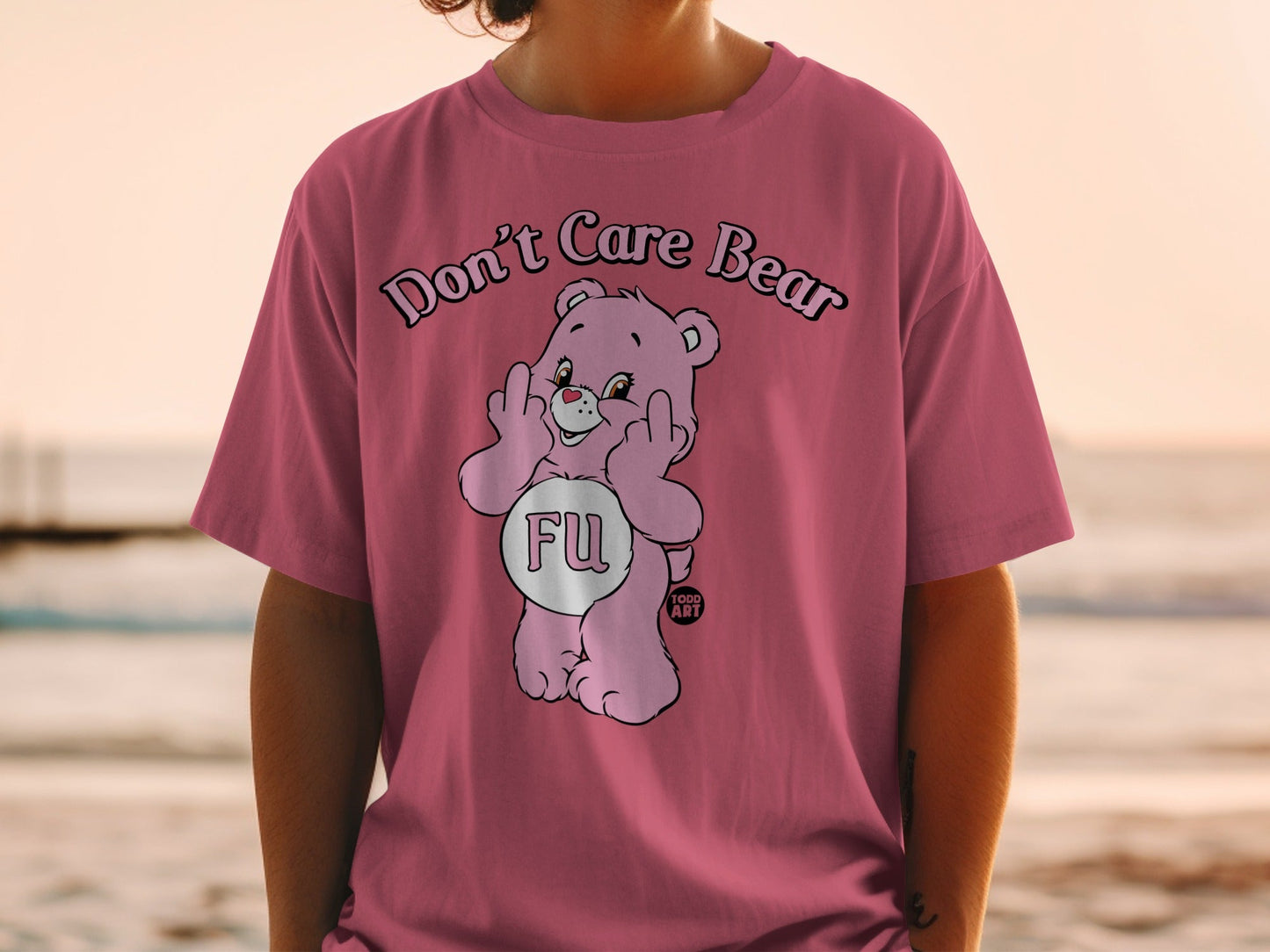 Pink t-shirt with Care Bear giving middle fingers and "FU" text.