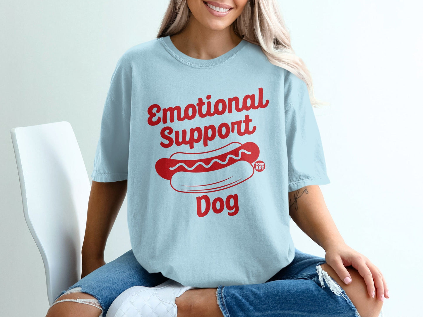 Light blue t-shirt with red "Emotional Support Dog" text and hot dog graphic.
