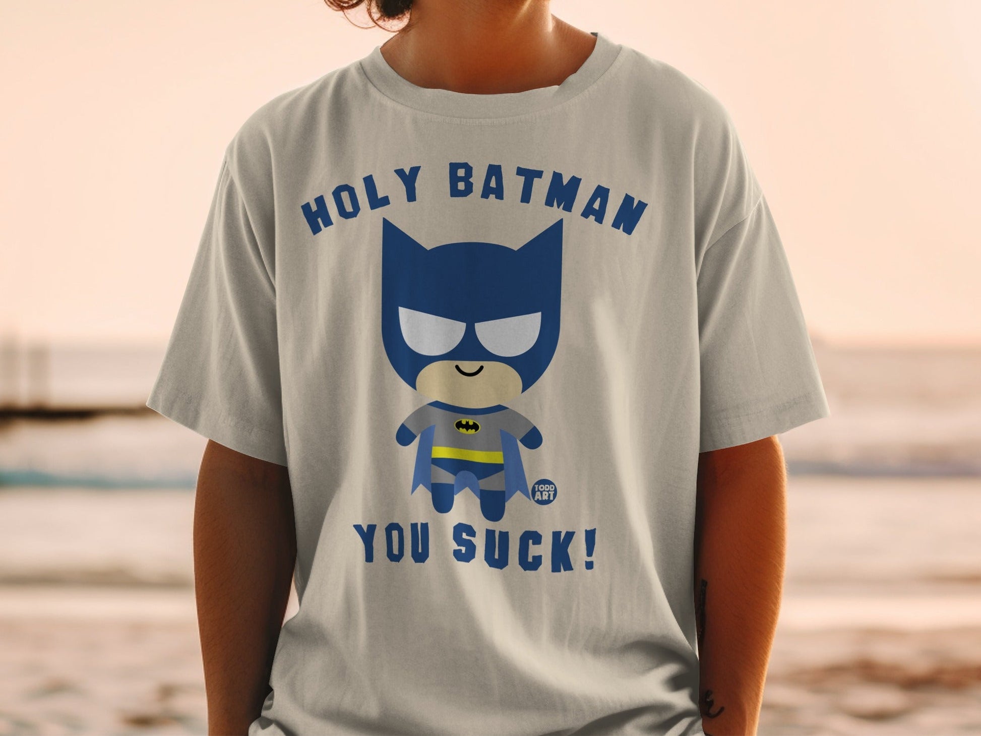 Chibi Batman graphic tee with text "HOLY BATMAN YOU SUCK!".
