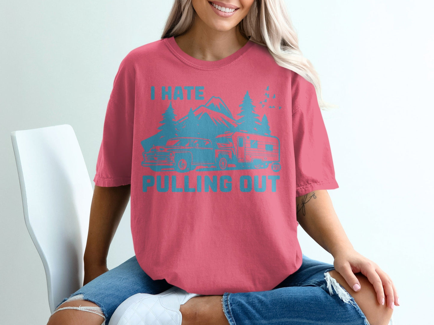 Coral t-shirt with "I HATE PULLING OUT" text, mountain, tree, and camper graphic.