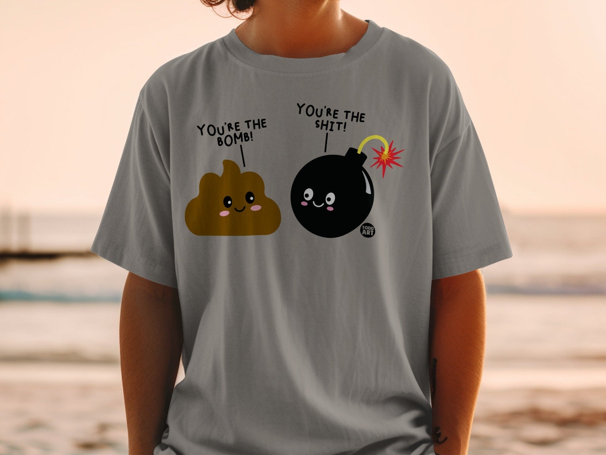 Poop and bomb characters on a gray t-shirt saying "You're the bomb!"