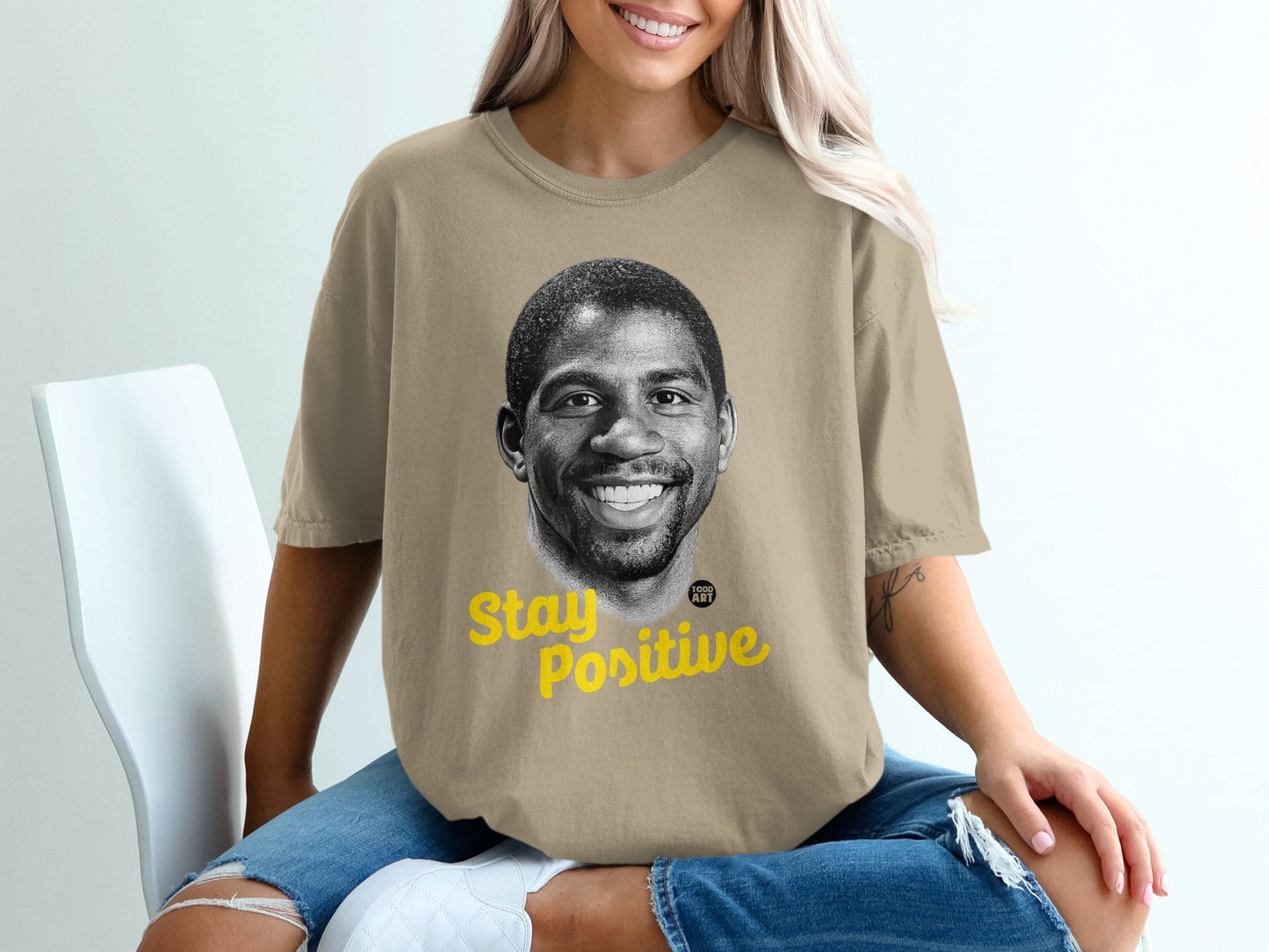 T-shirt with Magic Johnson's portrait and "Stay Positive" text.