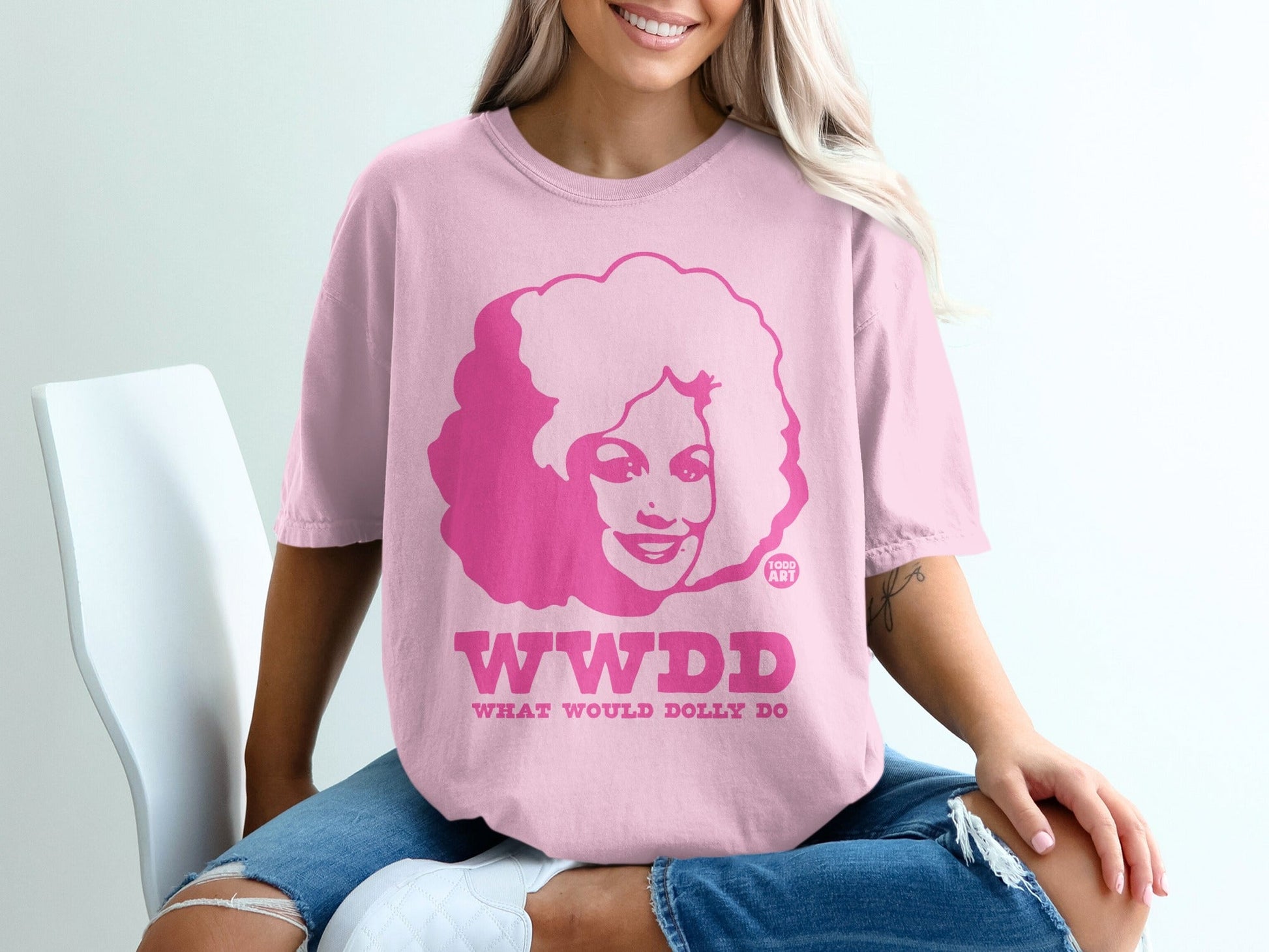 Pink t-shirt with "WWDD" and "TODD ART" in bold pink text.