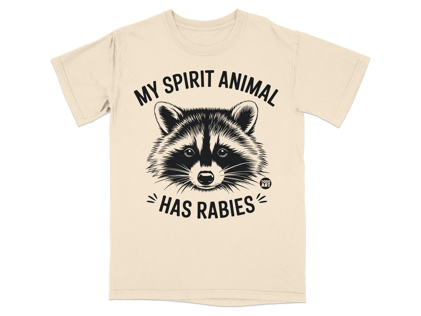 T-shirt with raccoon graphic and text "My spirit animal has rabies".