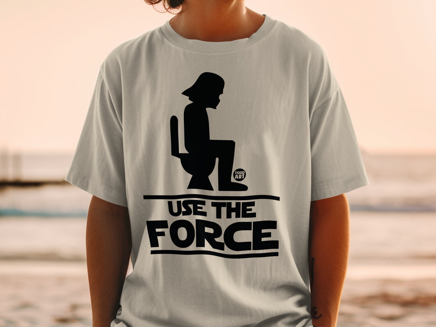 T-shirt graphic with Darth Vader on a toilet and the text "USE THE FORCE".