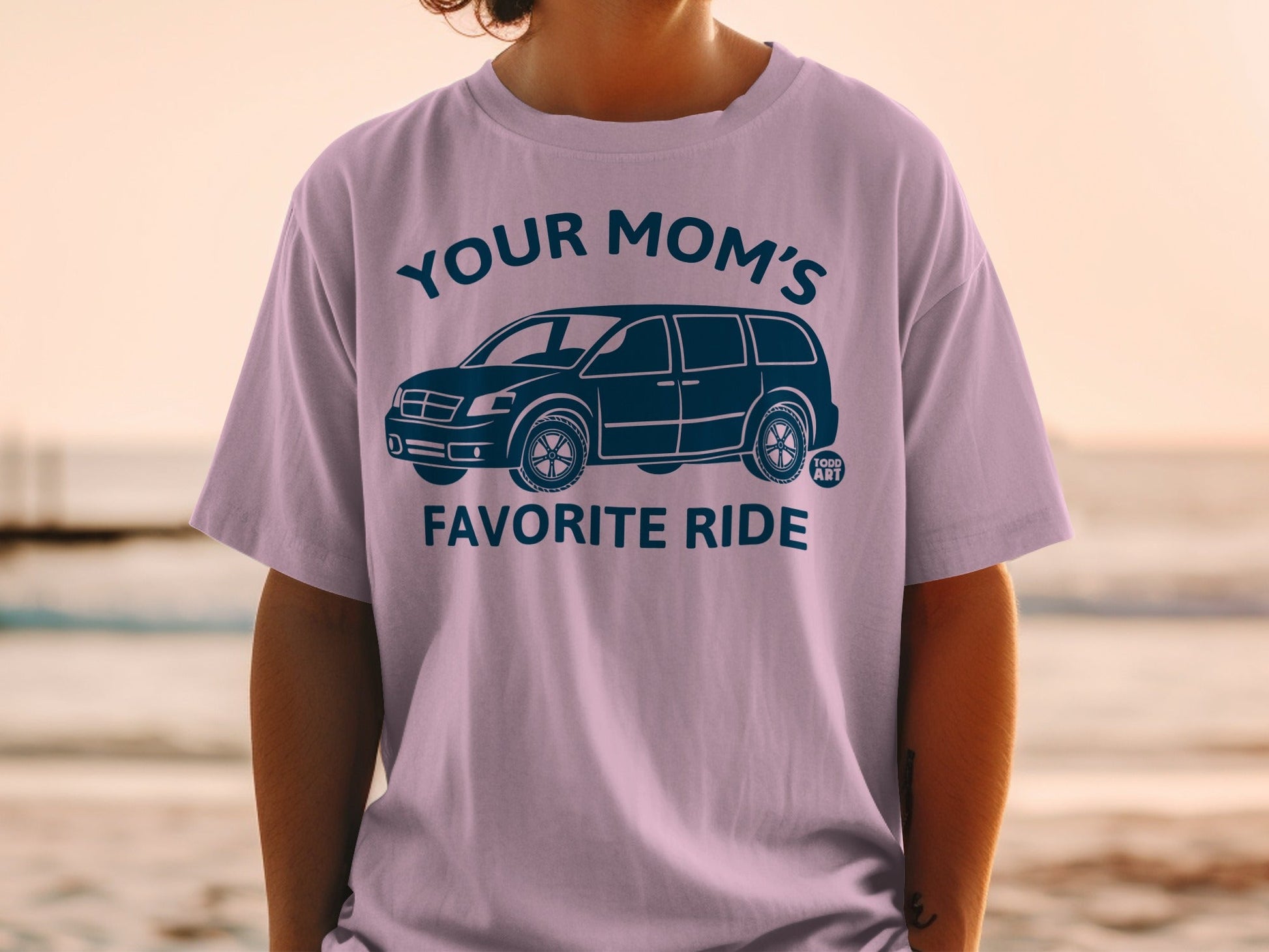 T-shirt with "Your Mom's Favorite Ride" text and minivan graphic.