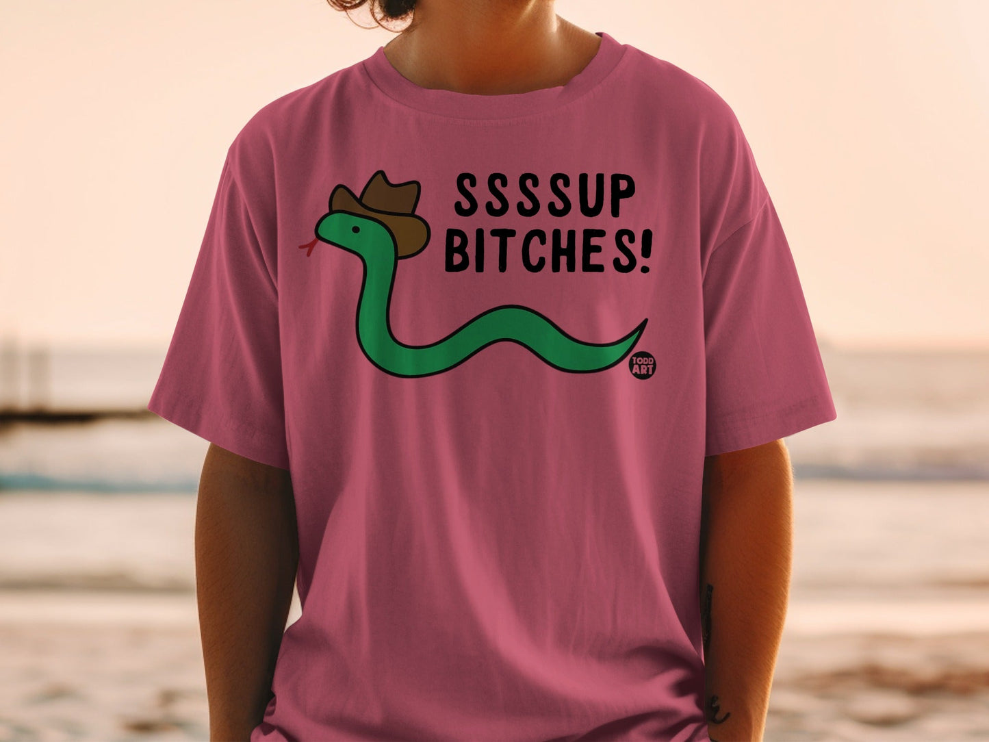 T-shirt with green snake wearing a cowboy hat and text "SSSSUP BITCHES!"