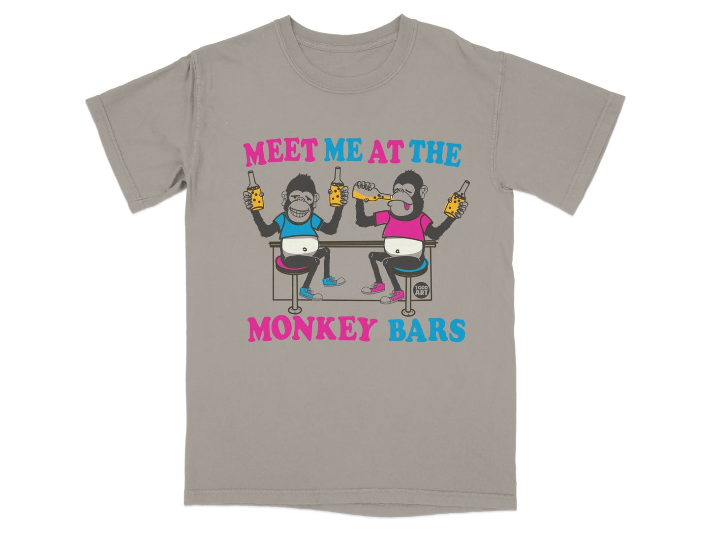 T-shirt graphic with two monkeys holding drinks at a bar, text reads "MEET ME AT THE MONKEY BARS".