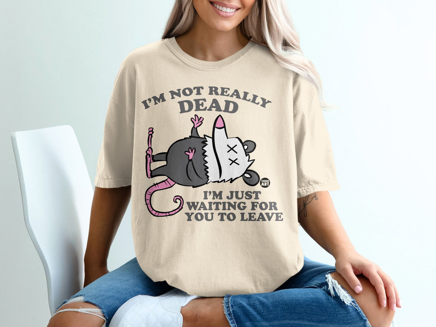 T-shirt with cartoon opossum and text "I'M NOT REALLY DEAD I'M JUST WAITING FOR YOU TO LEAVE."