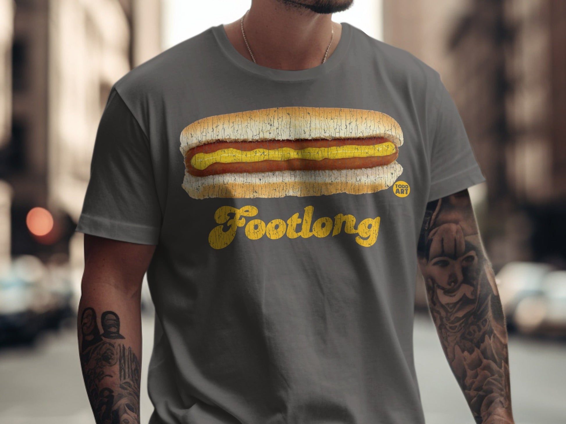 Grey t-shirt with "Footlong" and hot dog graphic.