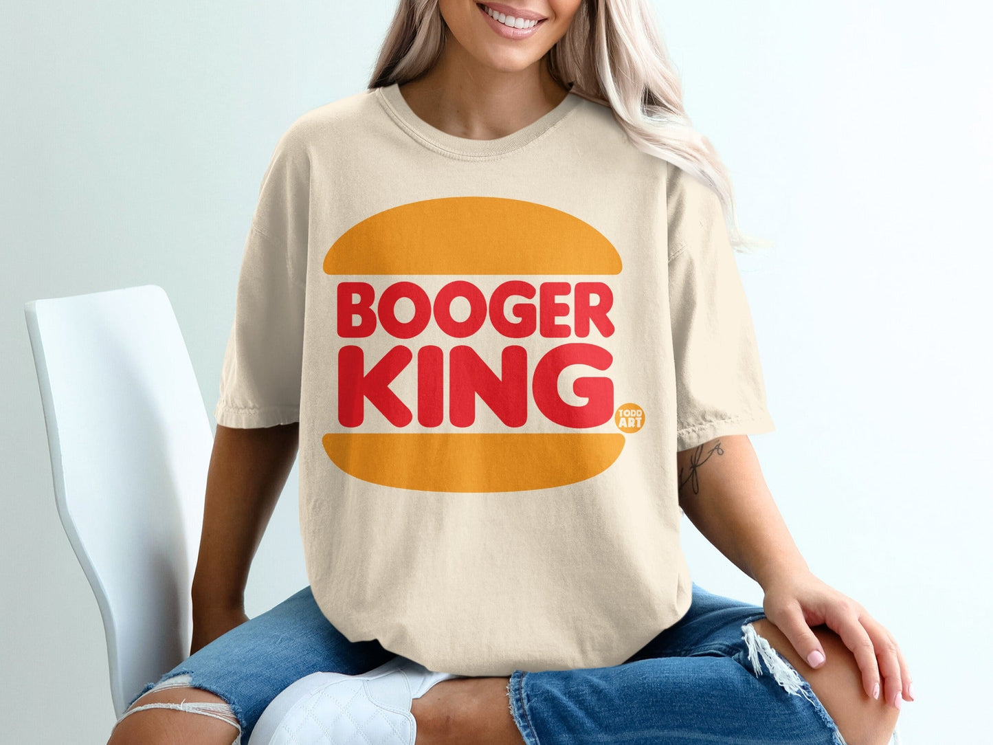 Beige t-shirt with "Booger King" in red text on a burger graphic.