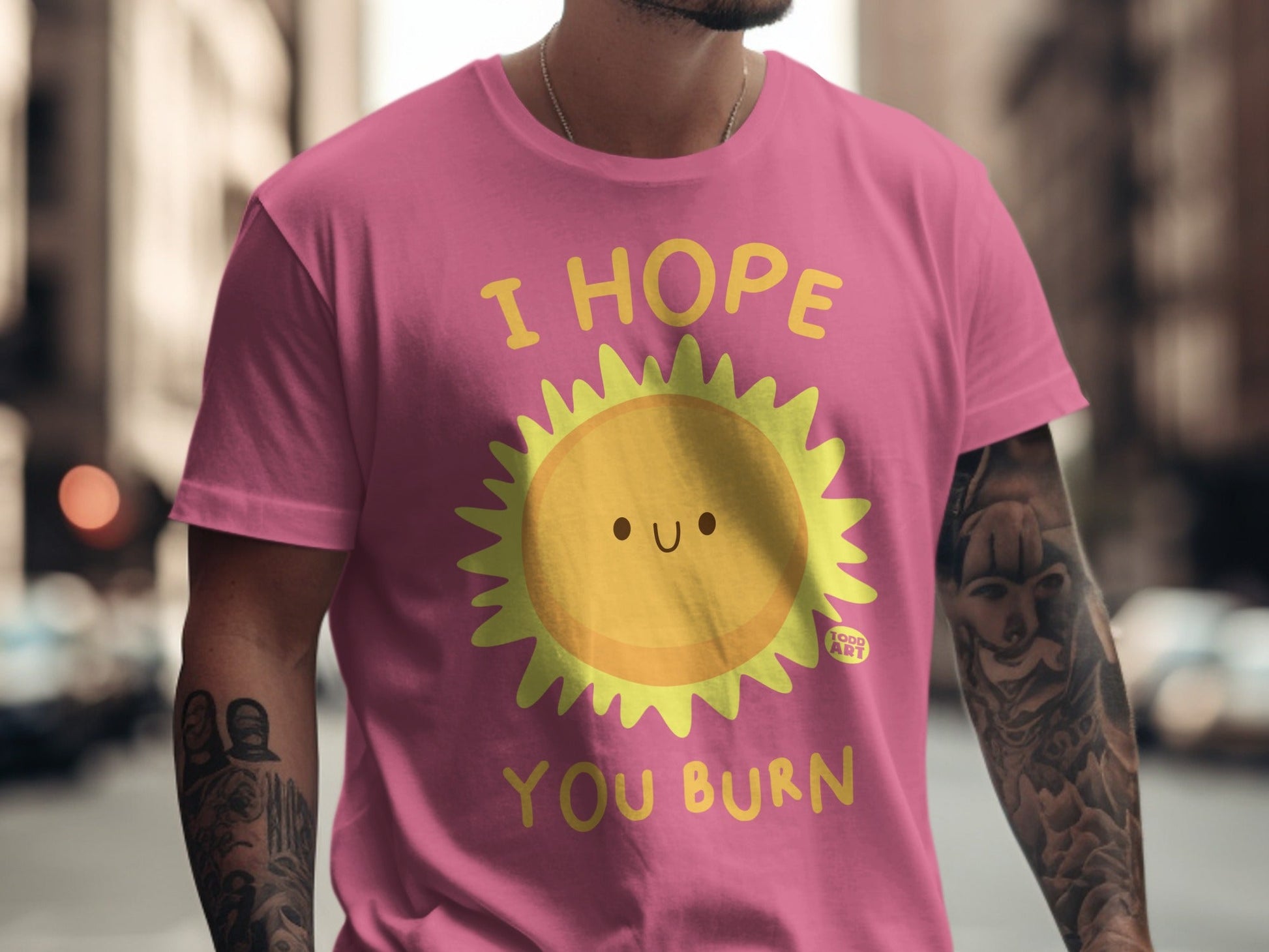 Pink t-shirt with "I HOPE YOU BURN" and a smiling sun graphic.