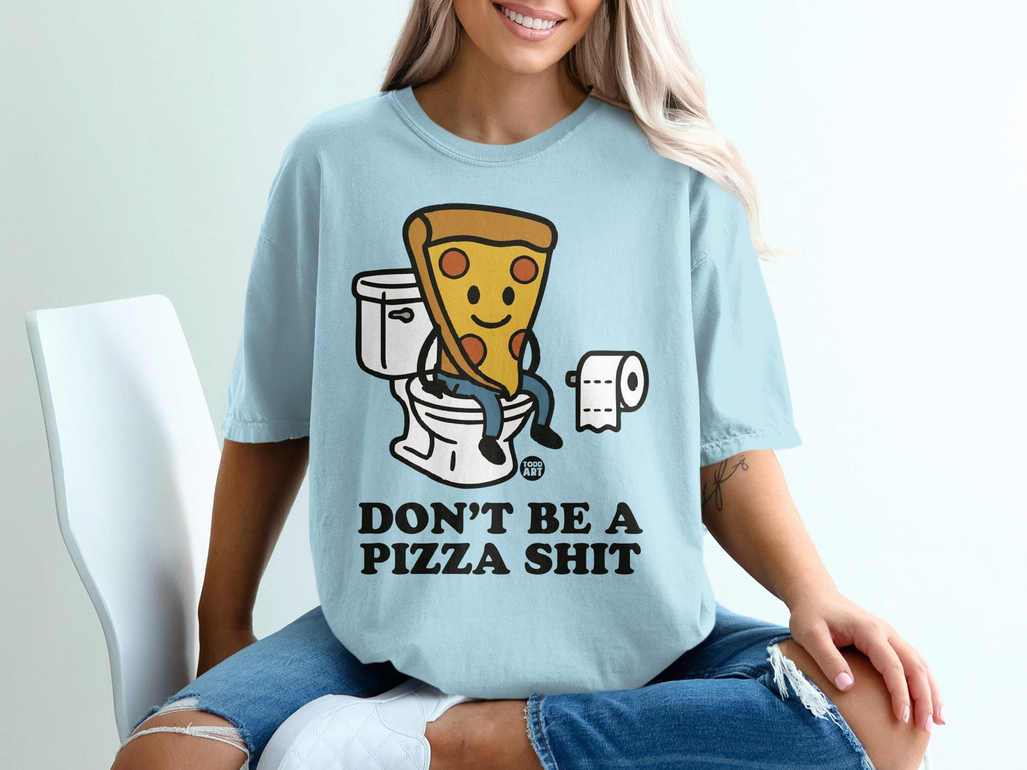 Light blue t-shirt with cartoon pizza slice on a toilet, text "DON'T BE A PIZZA SHIT".