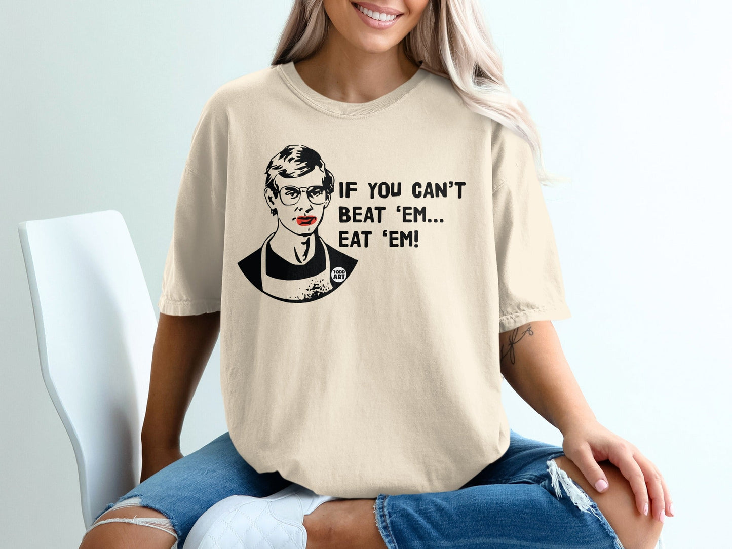 Cream t-shirt with graphic of Ruth Bader Ginsburg and text "If you can't beat 'em... eat 'em."