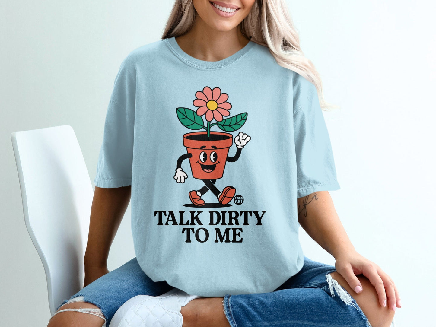 Light blue t-shirt with cartoon flower pot character and "Talk Dirty to Me" text.