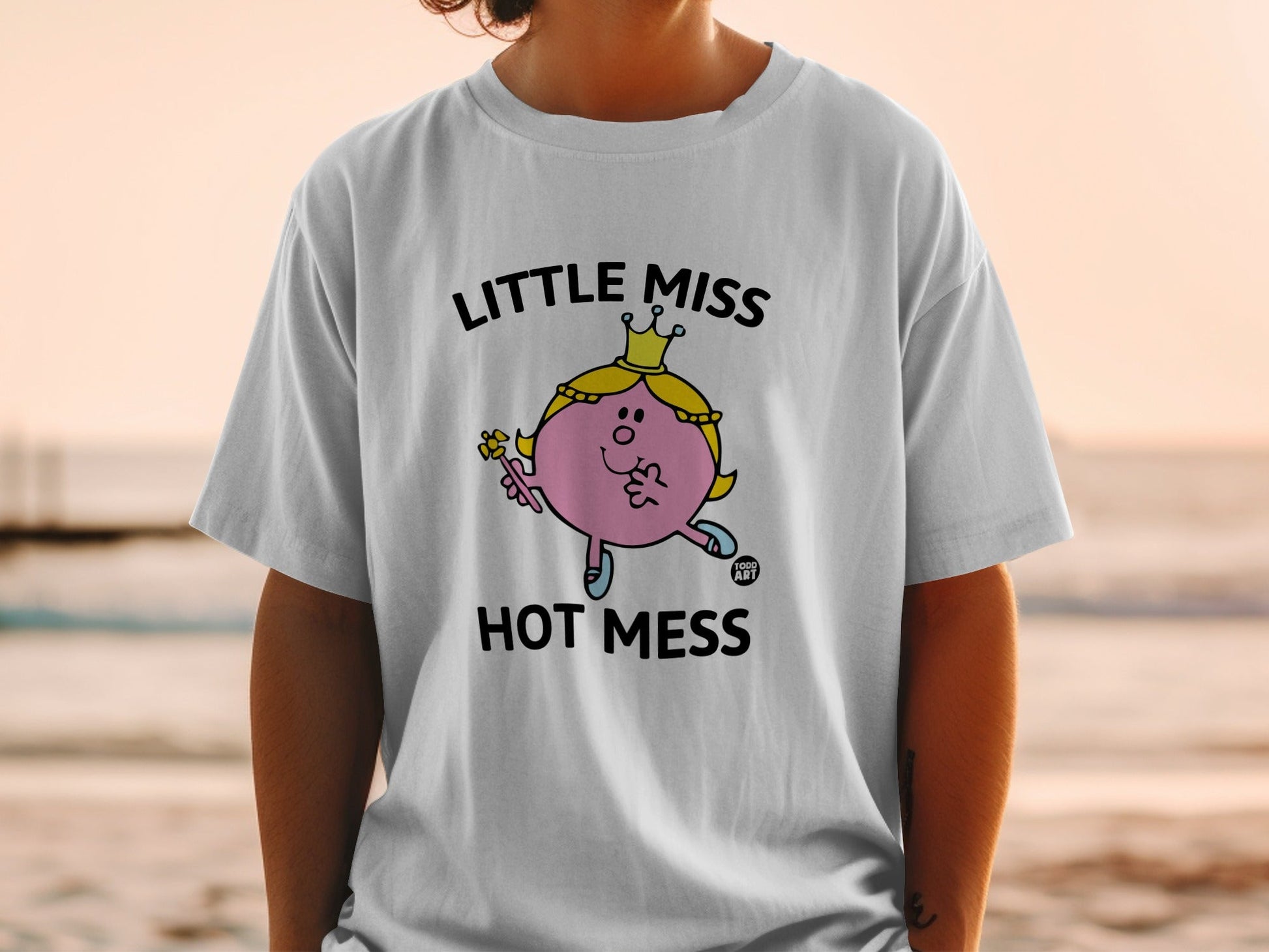 Little Miss Hot Mess graphic on a white t-shirt.