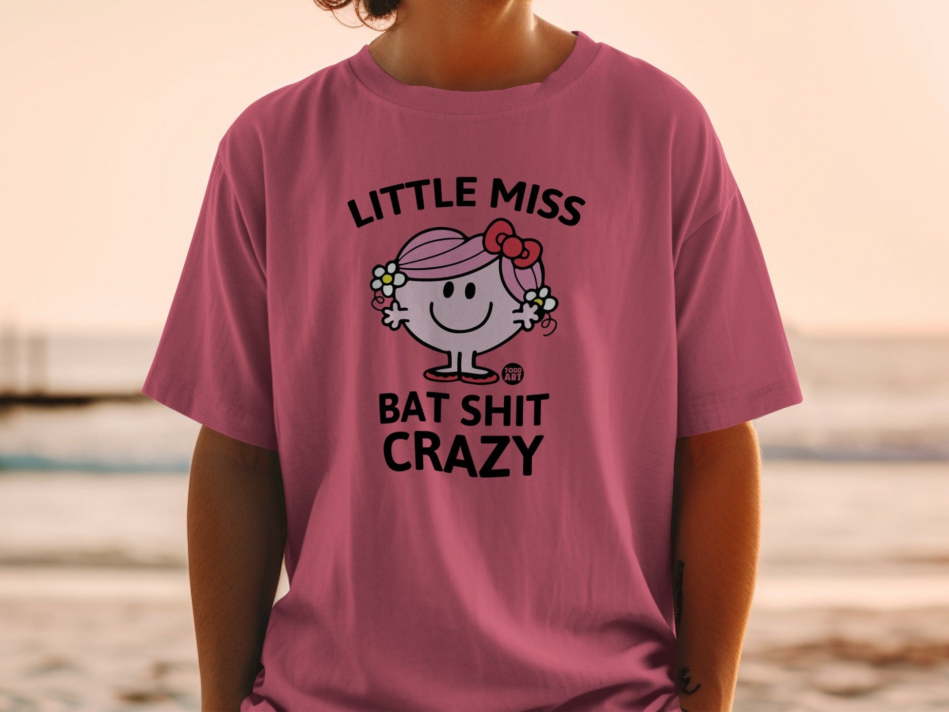 Pink t-shirt with "Little Miss Bat Shit Crazy" and cartoon character.