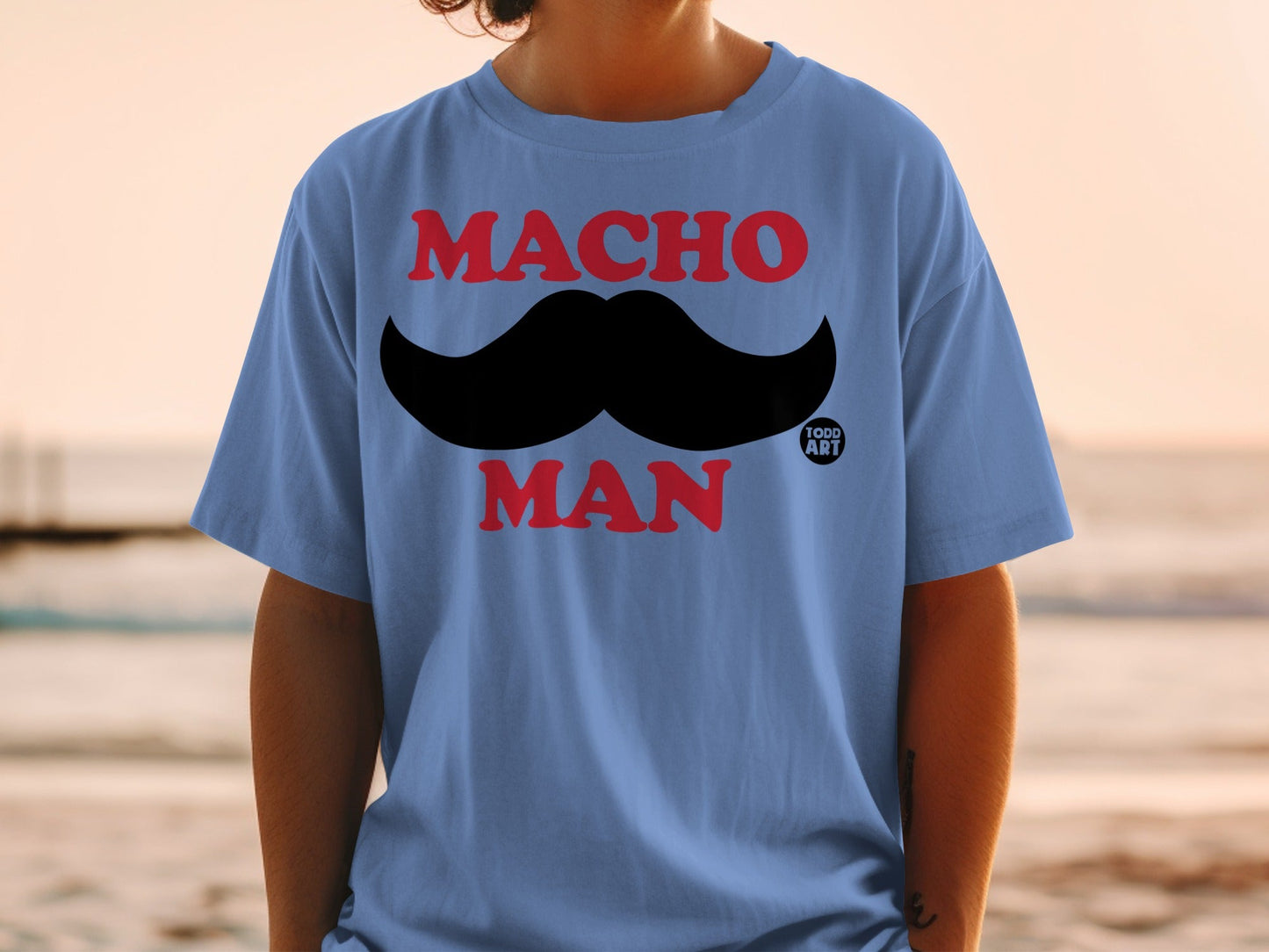 Blue t-shirt with "MACHO MAN" and a black mustache graphic.