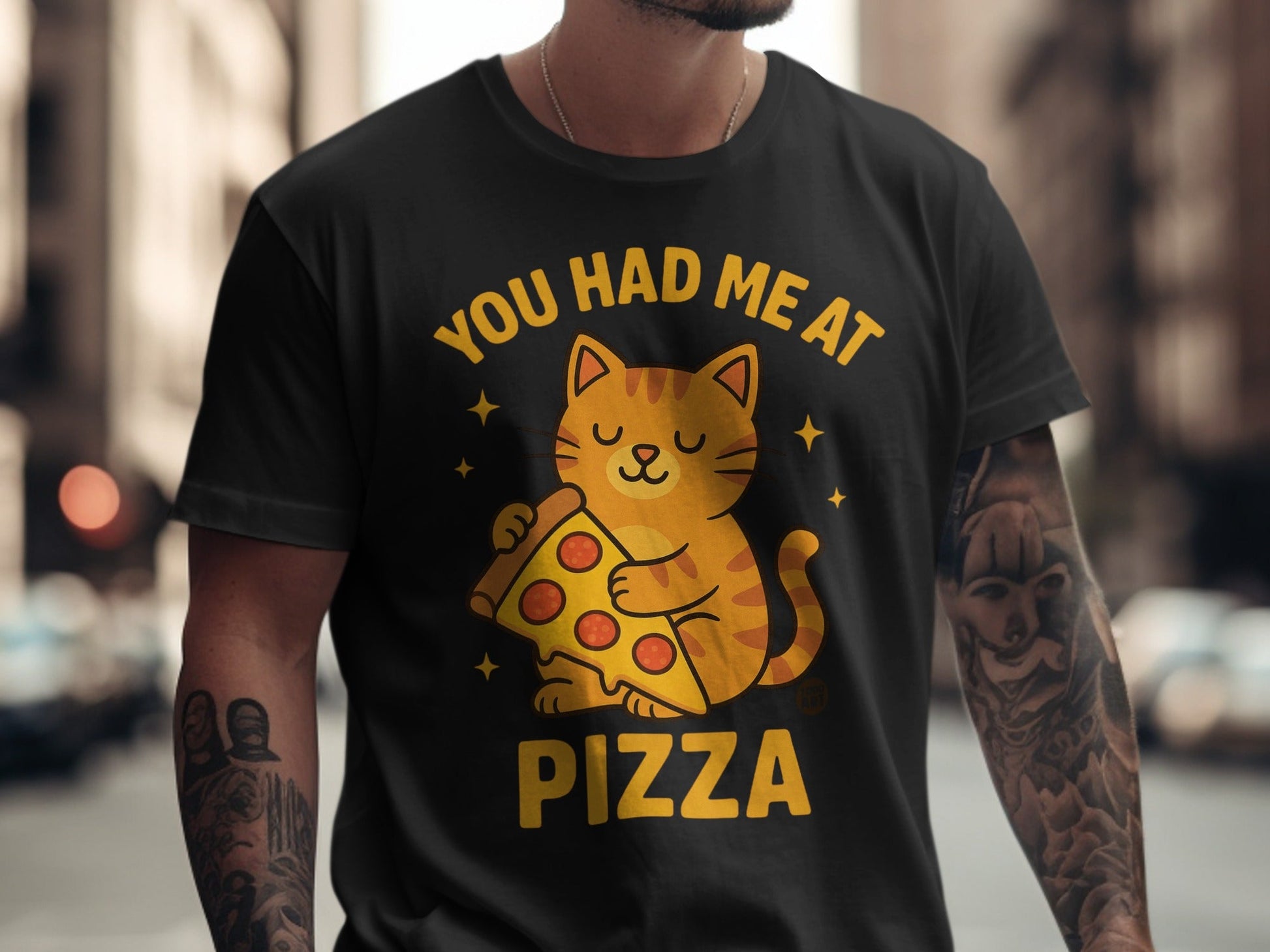 Black t-shirt with cartoon cat holding pizza and text "You had me at Pizza".