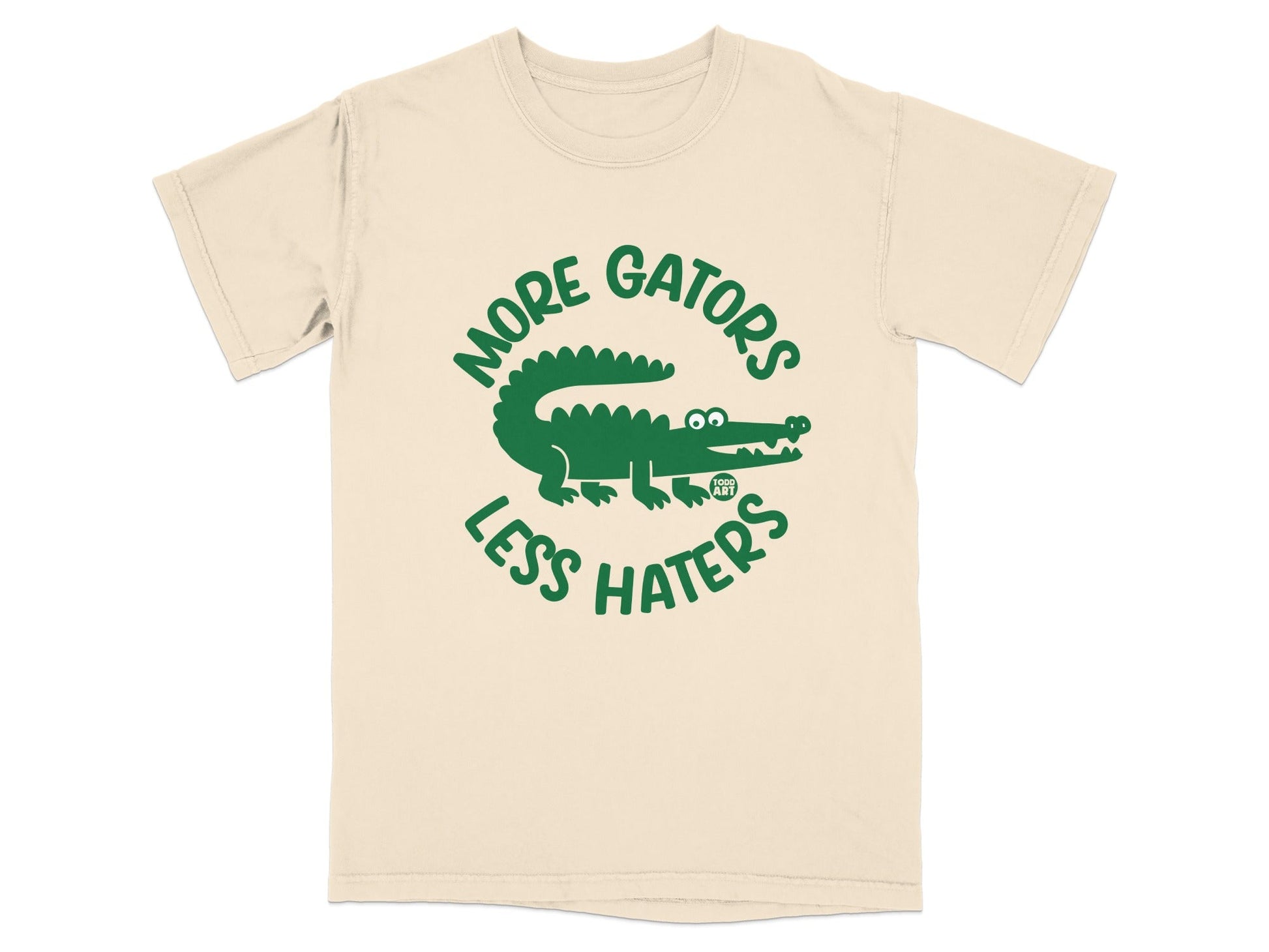 Cream t-shirt with green "More Gators Less Haters" text and alligator graphic.