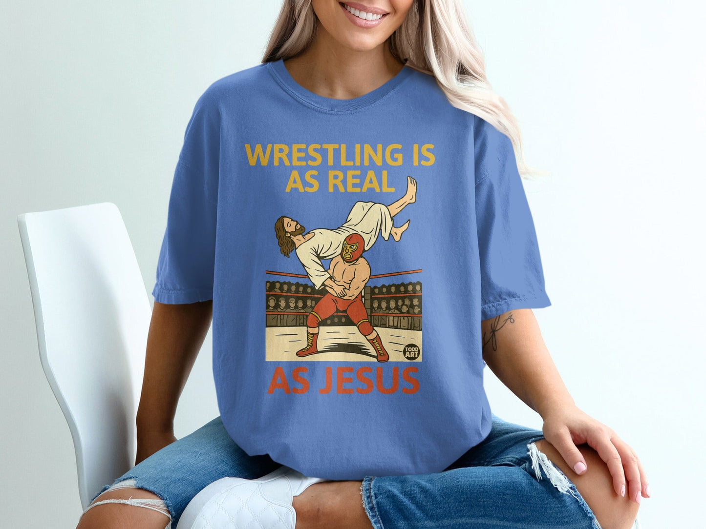 T-shirt with graphic of Jesus wrestling an opponent in a ring.