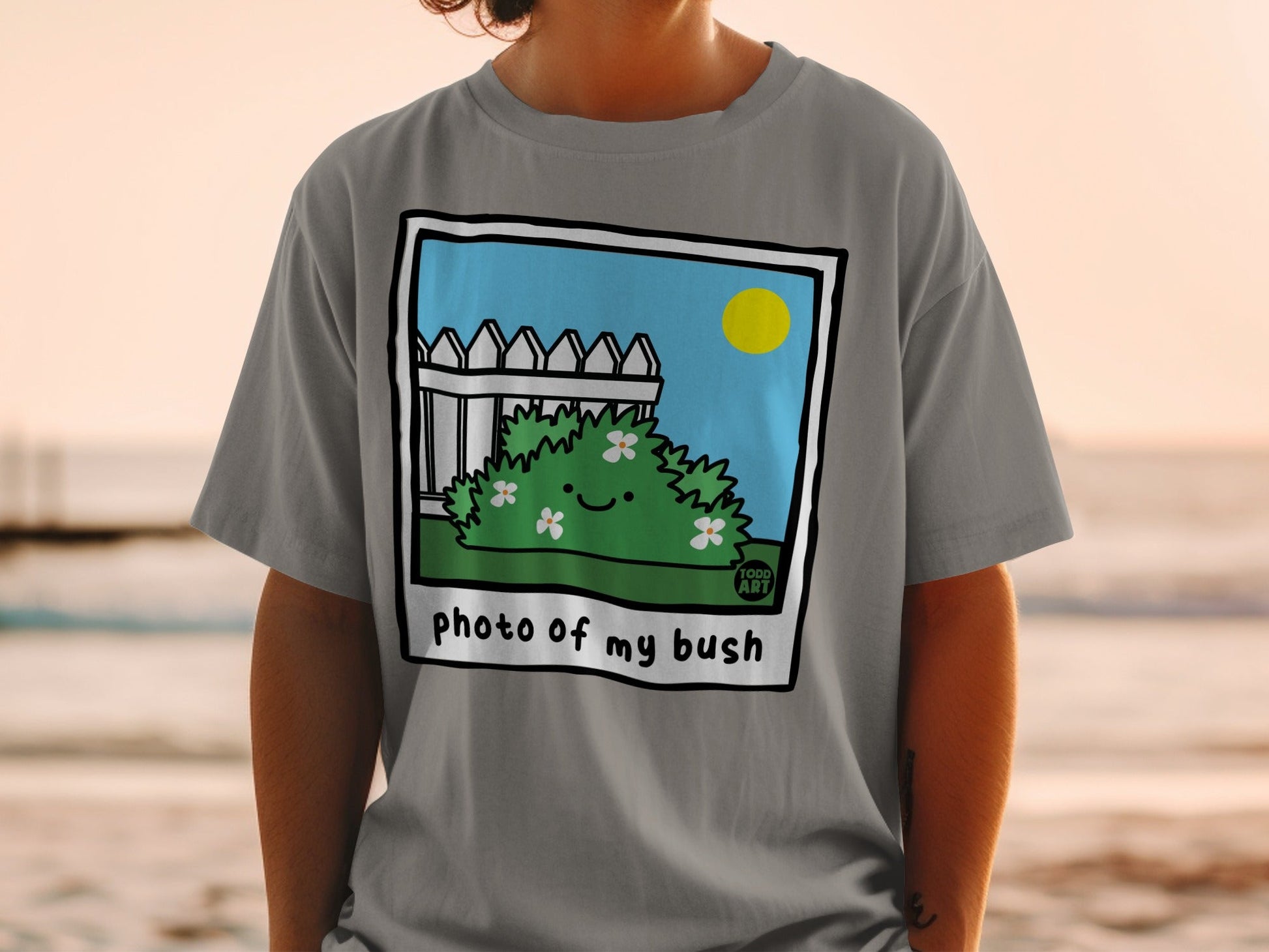 Illustration of a smiling bush with flowers, fence, and sun.