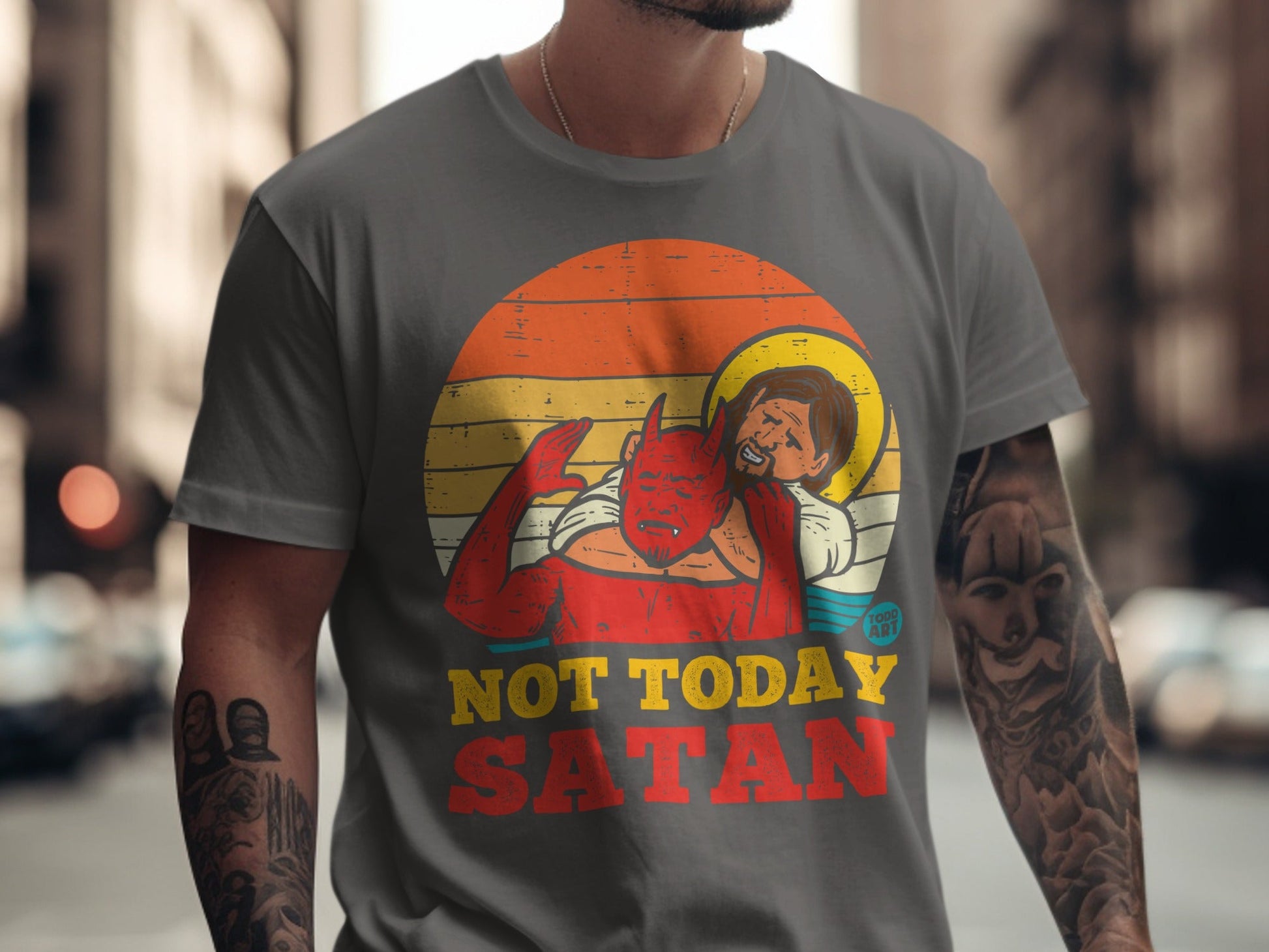 T-shirt with distressed graphic of Jesus restraining a devil, text reads "NOT TODAY SATAN".