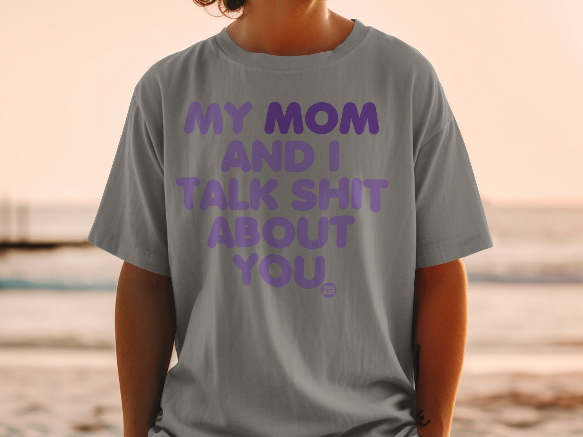 Gray t-shirt with purple text: MY MOM AND I TALK SHIT ABOUT YOU.