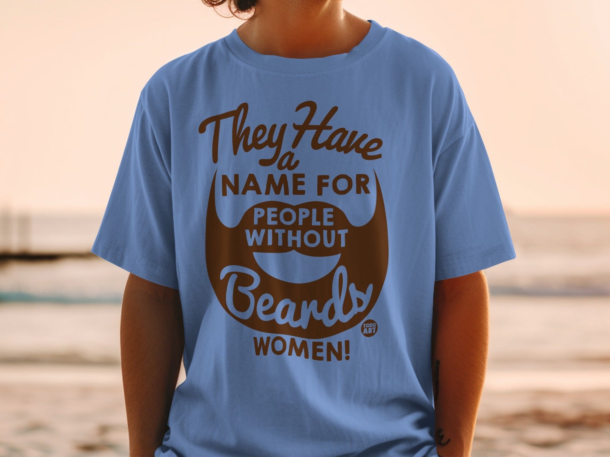 Blue t-shirt with text "They Have A Name For People Without Beards: WOMEN!"
